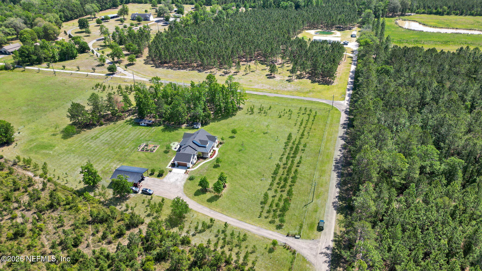 57353 Sandy Oaks Lane Callahan, FL 32011 - Photo 52 of 61 an aerial view of a residential houses with outdoor space and street view