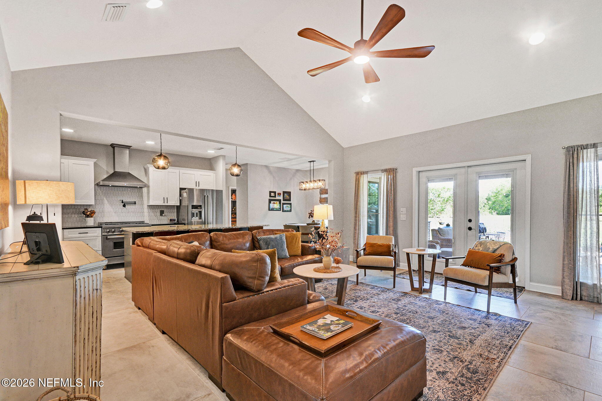 57353 Sandy Oaks Lane Callahan, FL 32011 - Photo 57 of 61 a living room with furniture kitchen view and a large window