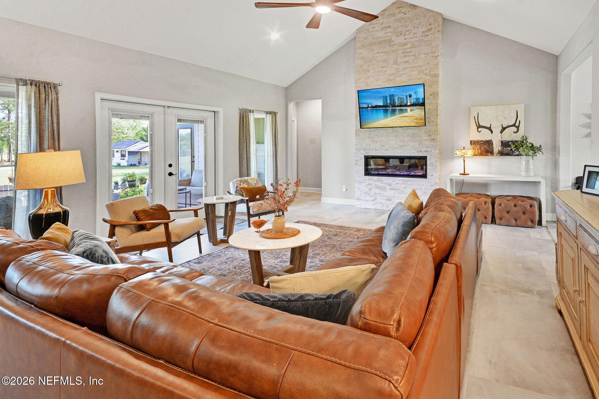 57353 Sandy Oaks Lane Callahan, FL 32011 - Photo 6 of 61 a living room with furniture a table and a window