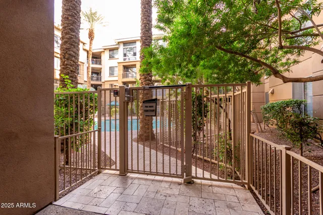 a view of a wrought iron fences in front of house