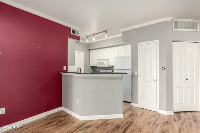 a view of kitchen with wooden floor