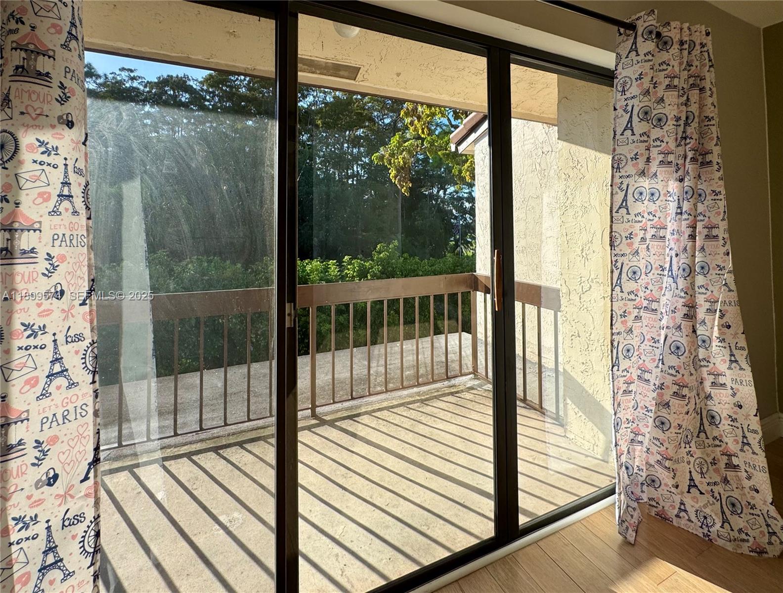 21643 Cypress Road, Unit 14D Boca Raton, FL 33433 - Photo 14 of 26 a view of a glass door with a balcony