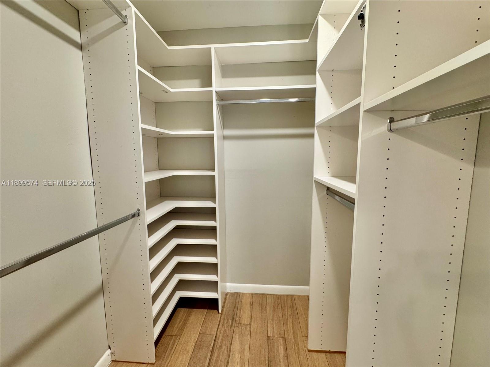 21643 Cypress Road, Unit 14D Boca Raton, FL 33433 - Photo 18 of 26 a view of walk in closet with empty racks
