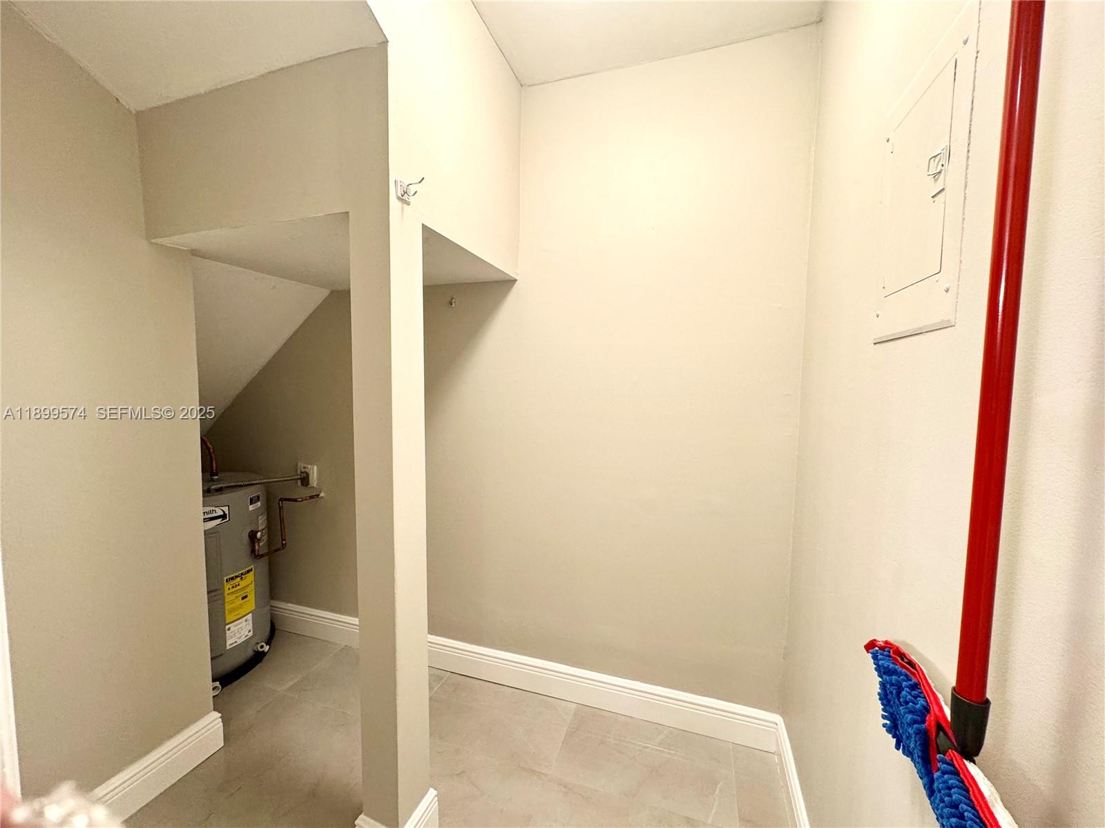 21643 Cypress Road, Unit 14D Boca Raton, FL 33433 - Photo 6 of 26 a view of walk in closet with clothes