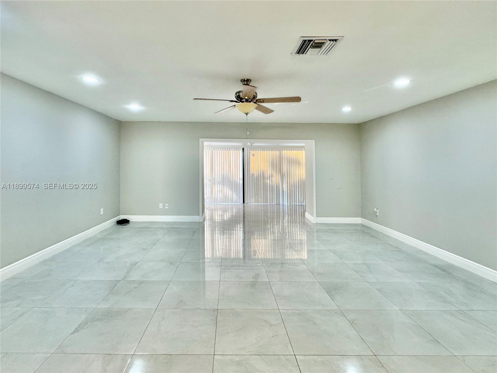 21643 Cypress Road, Unit 14D Boca Raton, FL 33433 - Photo 8 of 26 a view of an empty room with a window