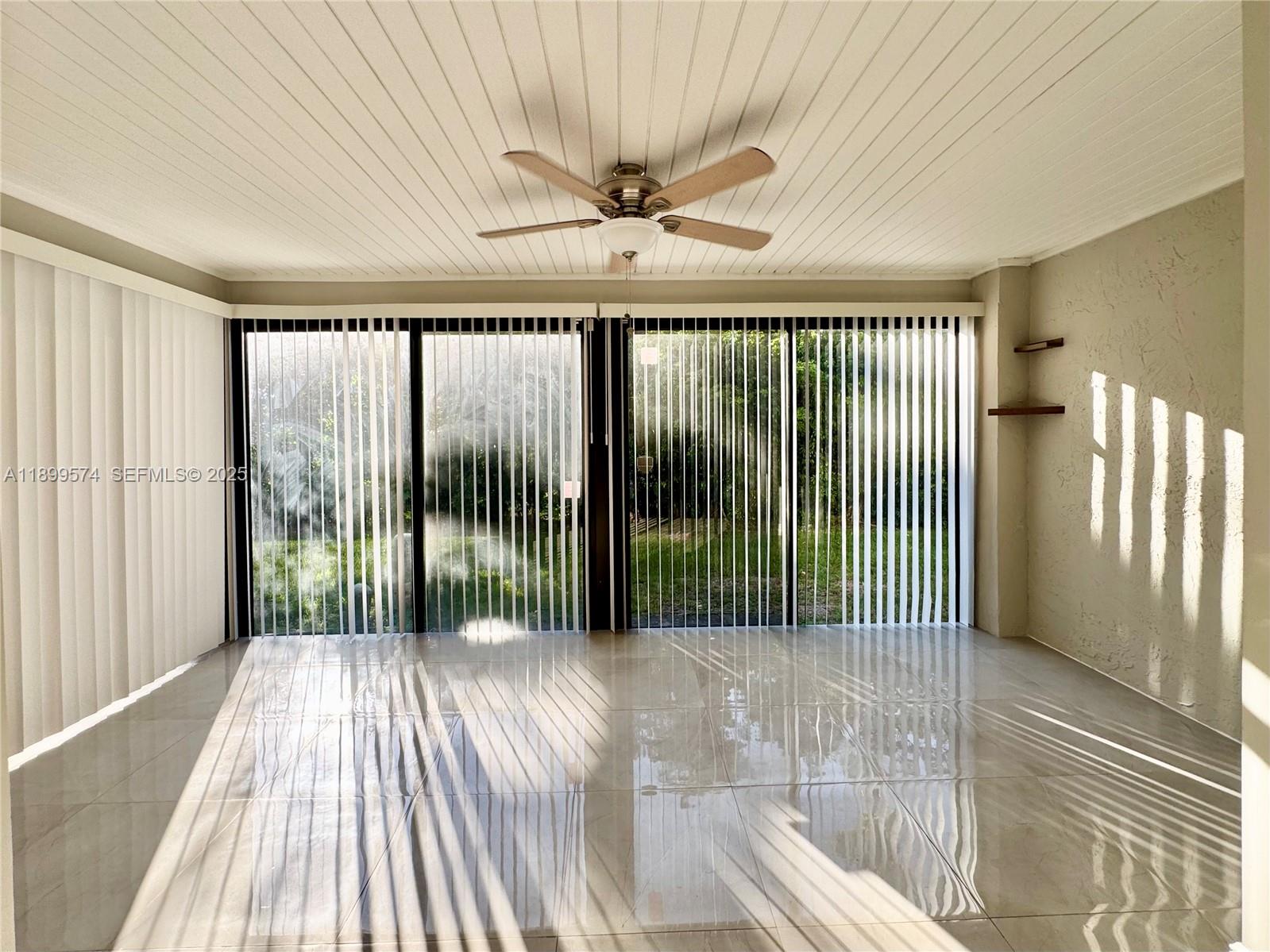 21643 Cypress Road, Unit 14D Boca Raton, FL 33433 - Photo 10 of 26 wooden floor in a hall with a window