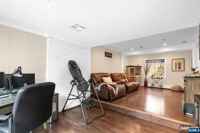 a living room with furniture rug and a window