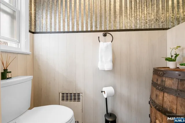 a bathroom with a toilet and a sink