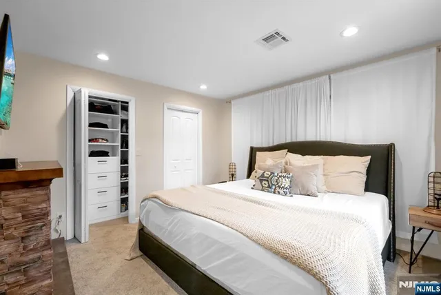 a bed room with a bed and a walk in closet