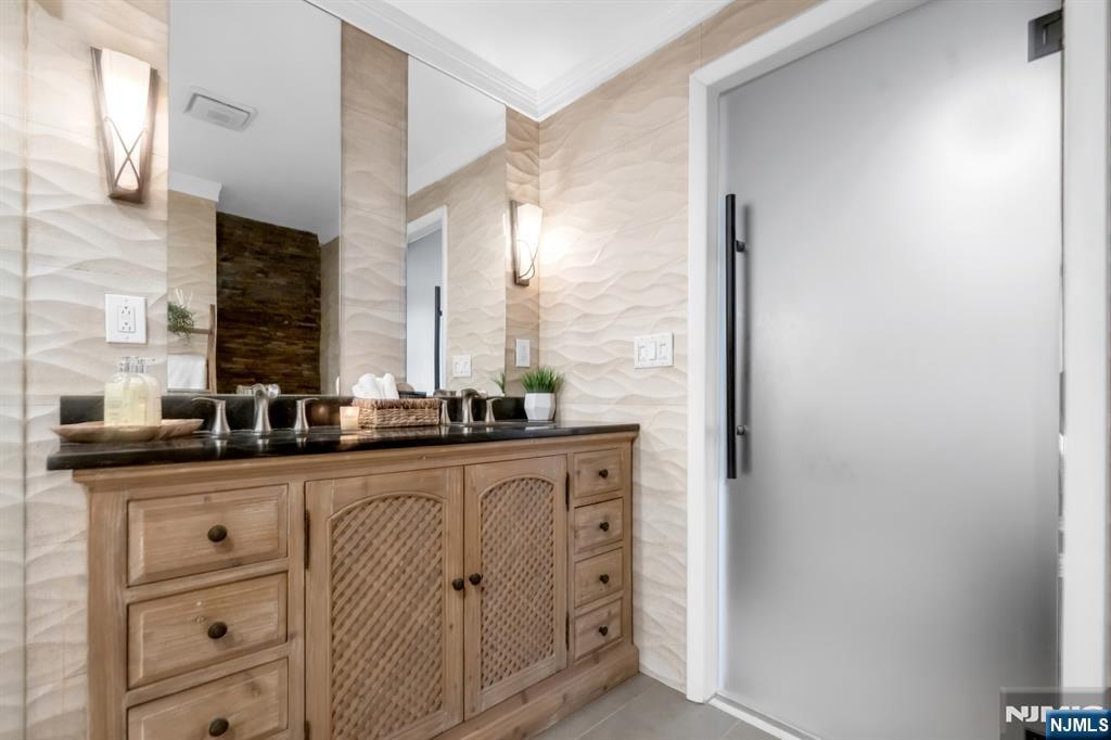 205 Davis Avenue Hackensack, NJ 07601 - Photo 25 of 47 a bathroom with a sink and a mirror