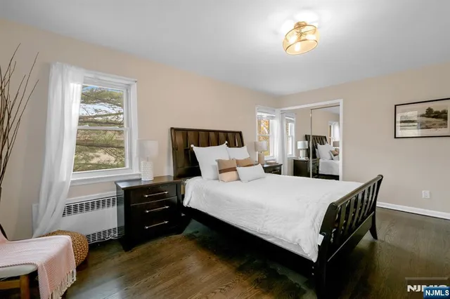 a bedroom with a bed and a table