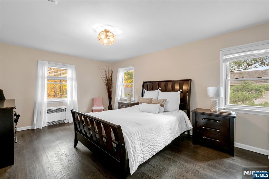 205 Davis Avenue Hackensack, NJ 07601 - Photo 28 of 47 a bedroom with a bed and a chandelier