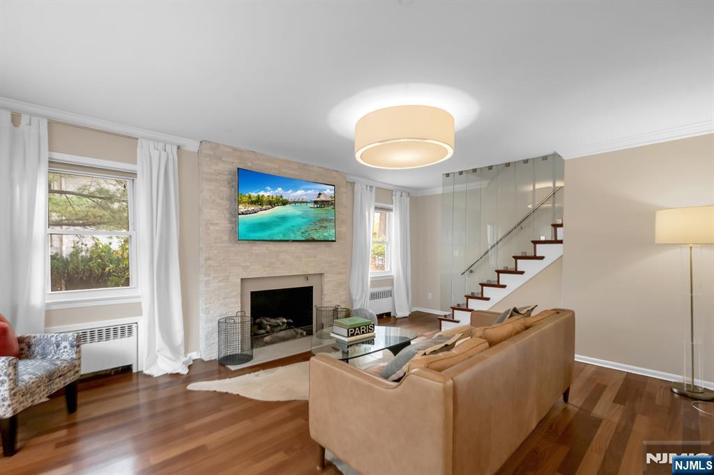 205 Davis Avenue Hackensack, NJ 07601 - Photo 3 of 47 a living room with furniture and a fireplace