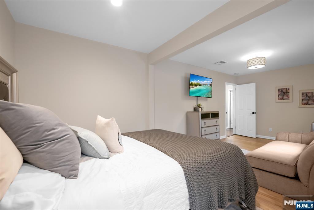 205 Davis Avenue Hackensack, NJ 07601 - Photo 34 of 47 a bedroom with a bed and a couch