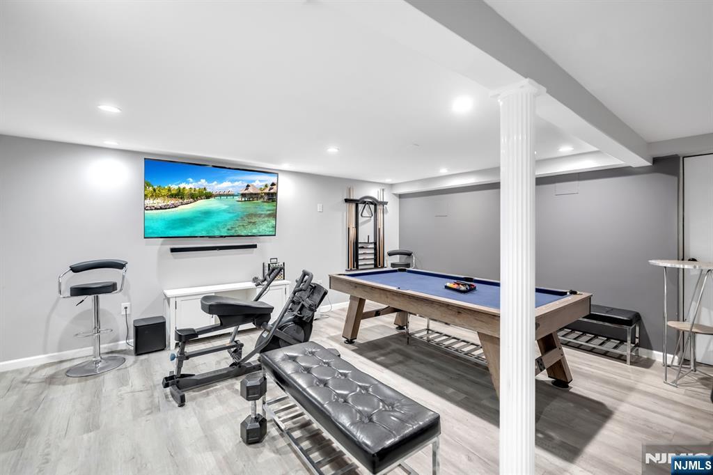 205 Davis Avenue Hackensack, NJ 07601 - Photo 39 of 47 a living room with furniture and a flat screen tv