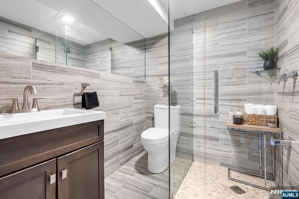 205 Davis Avenue Hackensack, NJ 07601 - Photo 42 of 47 a bathroom with a sink toilet and shower