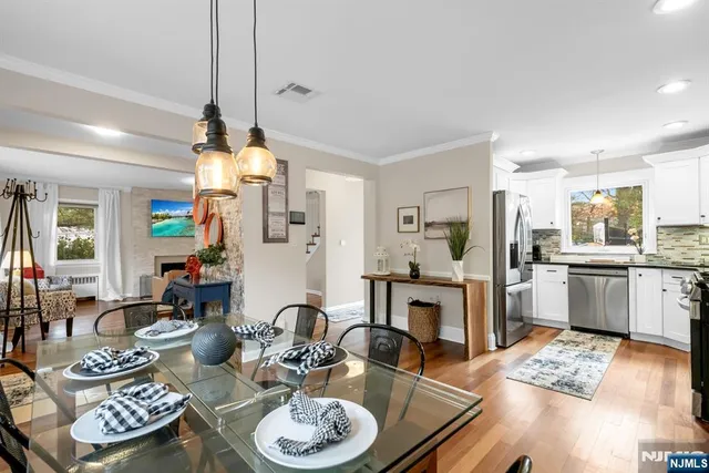 a living room with furniture and kitchen view