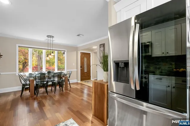 a view of a dining room with furniture window and outside view