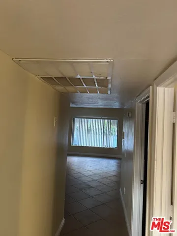 a white toilet sitting next to a shower