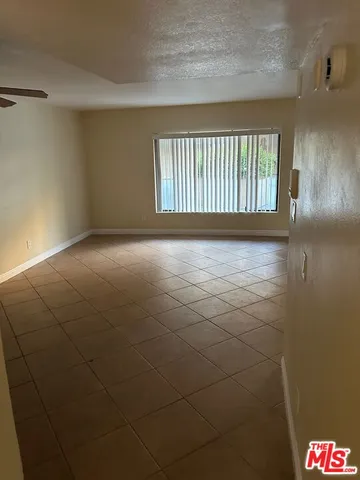 a white toilet sitting next to a shower