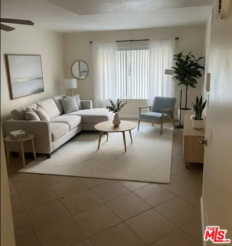 an empty room with wooden floor and entrance