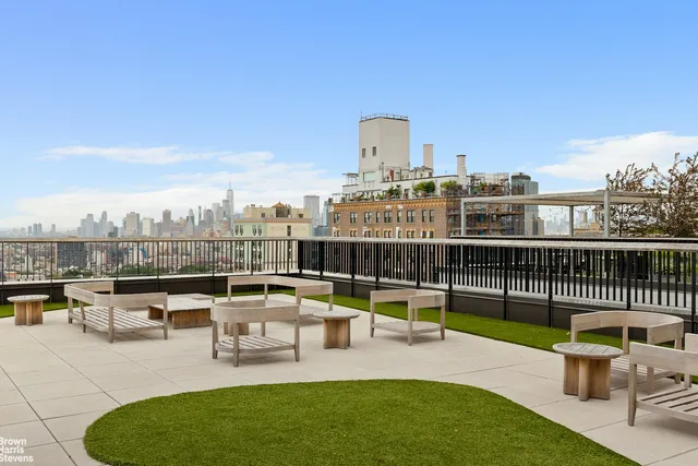 a bathroom with a sink vanity mirror and toilet