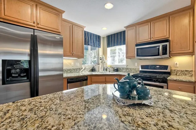 a living room with furniture and a book shelf