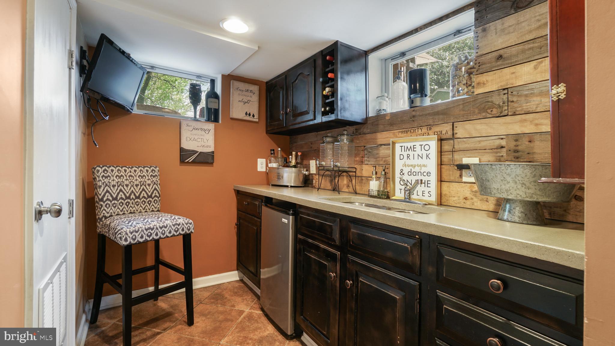 2709 Byron Street Silver Spring, MD 20902 - Photo 13 of 21 LL wet bar w/ concrete counters, reclaimed wood