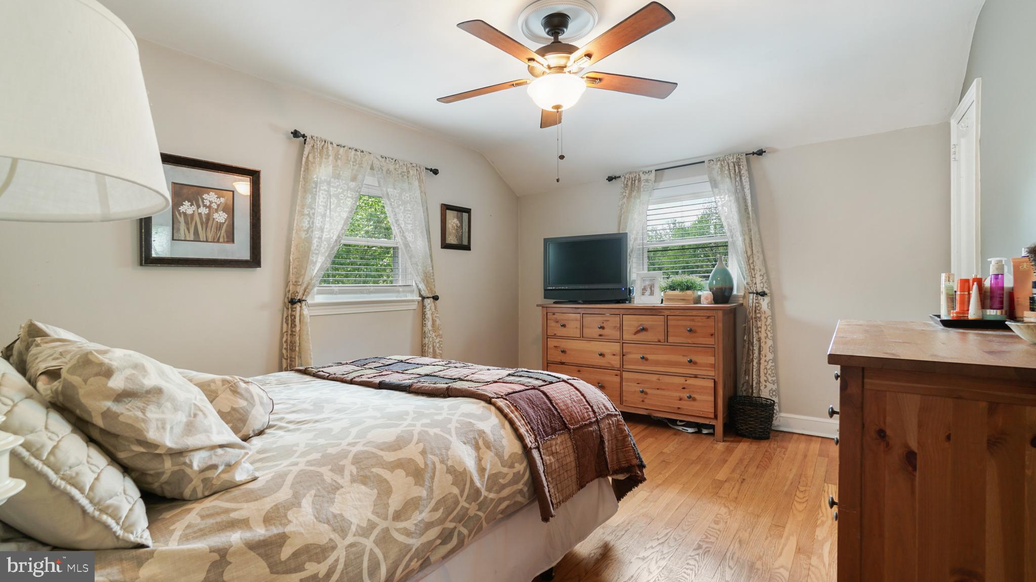 2709 Byron Street Silver Spring, MD 20902 - Photo 8 of 21 Master bedroom w/ ceiling fan & wood flooring