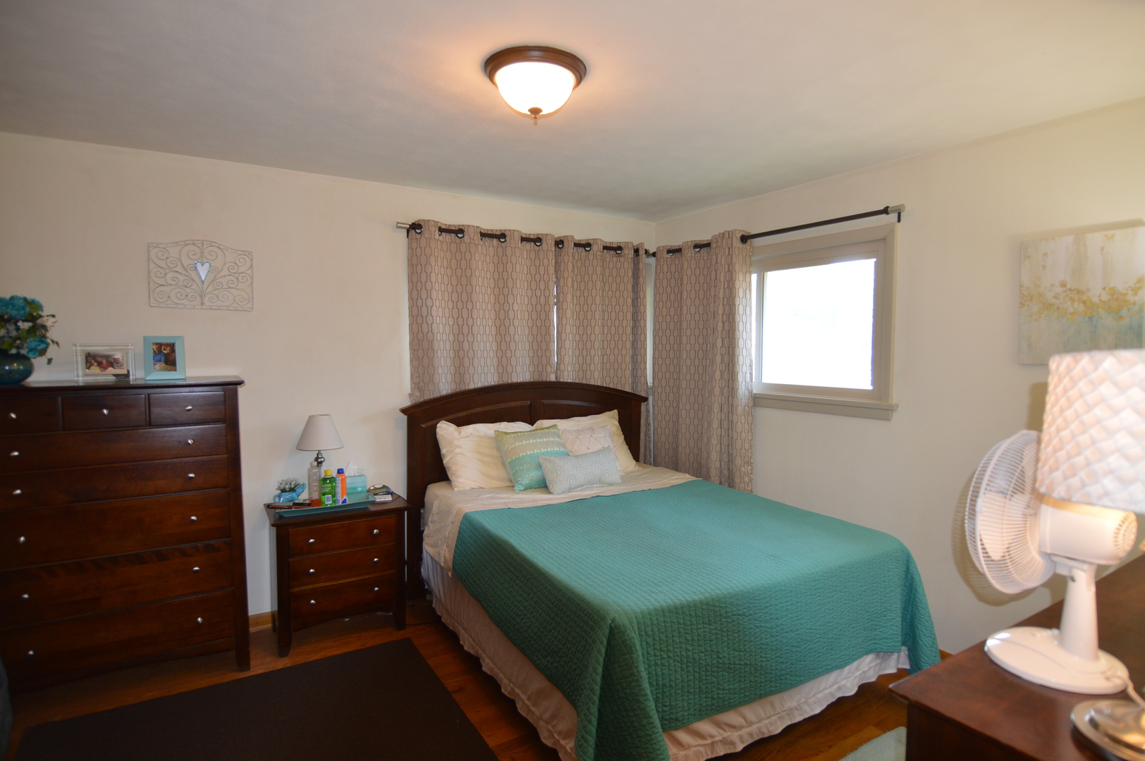414 Brown Street Wauconda, IL 60084 - Photo 14 of 29 a bedroom with a bed and a mirror on the dresser