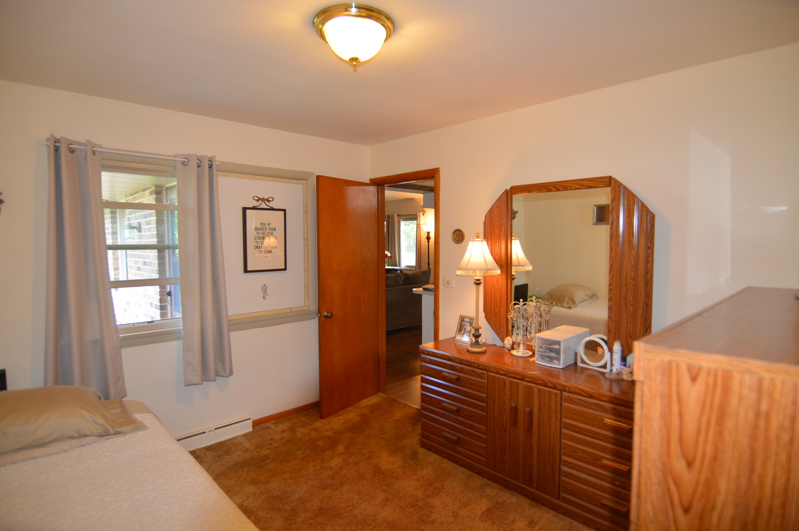 414 Brown Street Wauconda, IL 60084 - Photo 18 of 29 a view of a bedroom with furniture and mirror