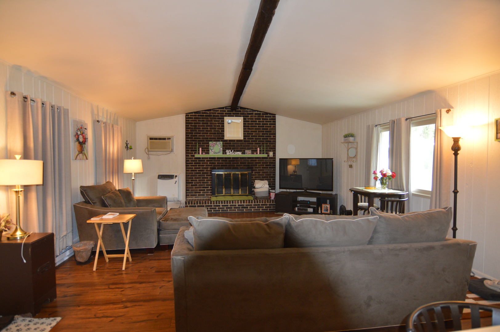 414 Brown Street Wauconda, IL 60084 - Photo 7 of 29 a living room with furniture and a flat screen tv