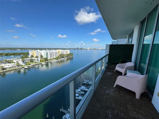 a view of a balcony with chairs