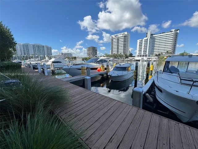 a view of a living room and kitchen with furniture