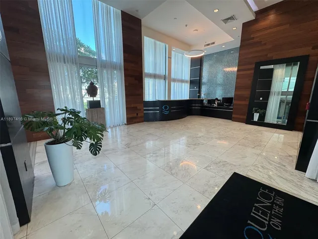 a view of an entryway with a potted plant