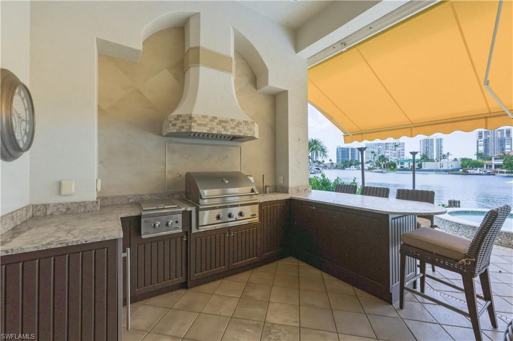 361 Pirates Bight Naples, FL 34103 - Photo 39 of 45 a kitchen with a sink and a stove