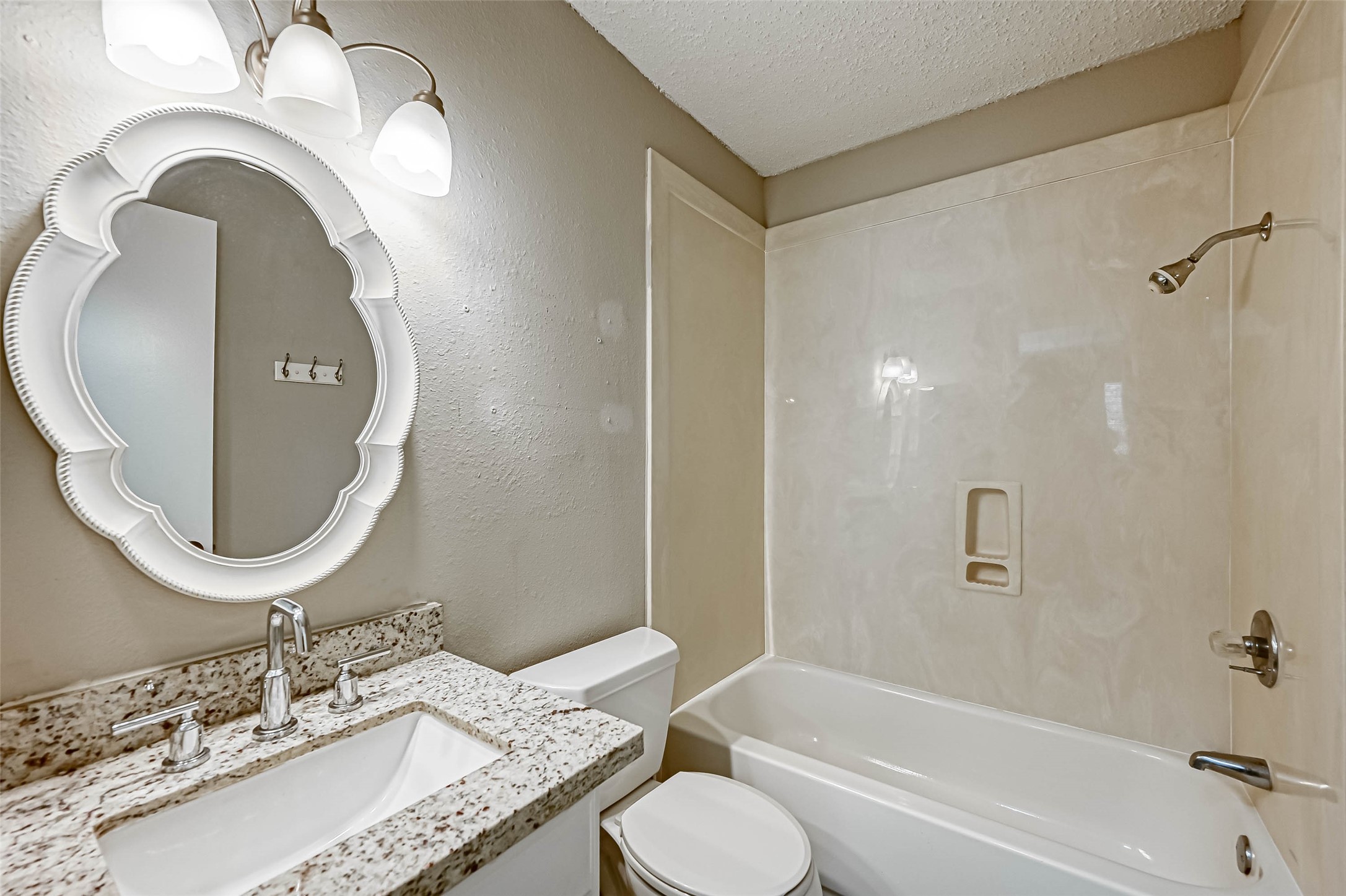 22622 John Rolfe Lane Katy, TX 77449 - Photo 11 of 21 a bathroom with a granite countertop sink mirror vanity and toilet
