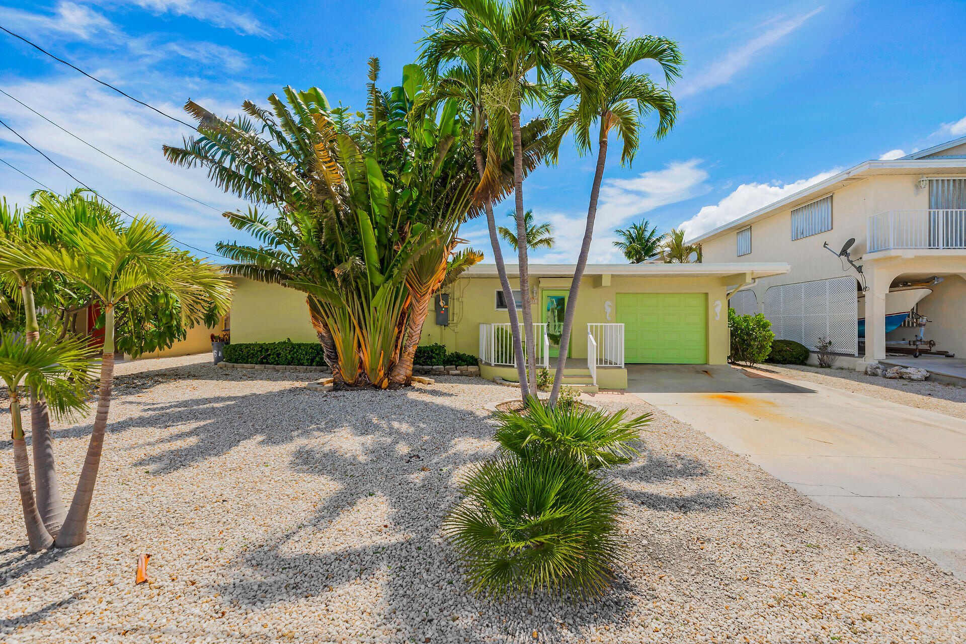 351 5th Street Key Colony Beach, FL 33051 - Photo 14 of 43 a view of a house with a tree and plants