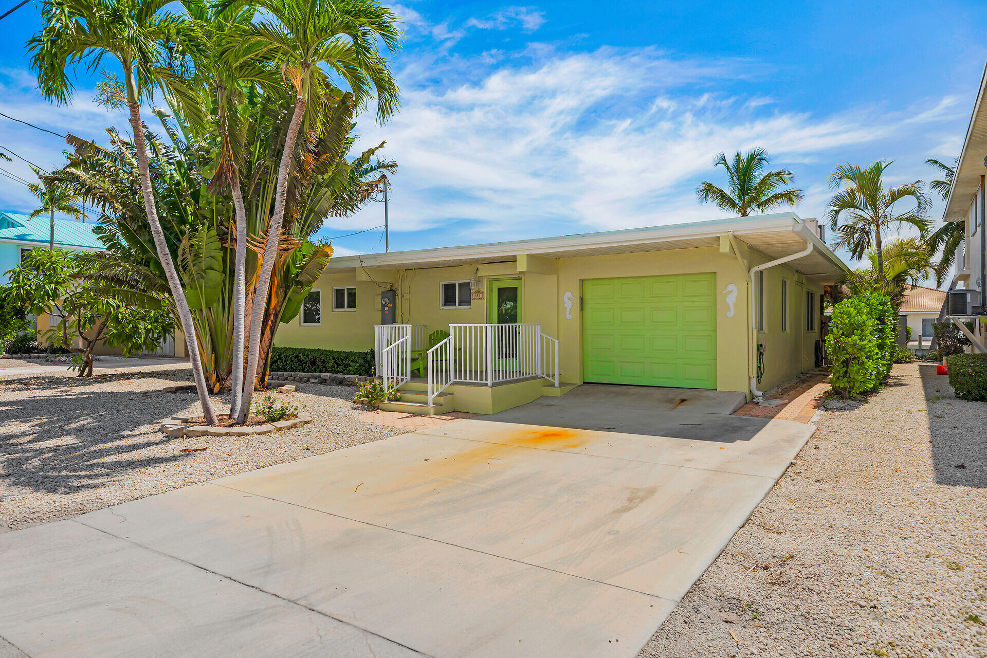 351 5th Street Key Colony Beach, FL 33051 - Photo 15 of 43 a front view of a house with garden