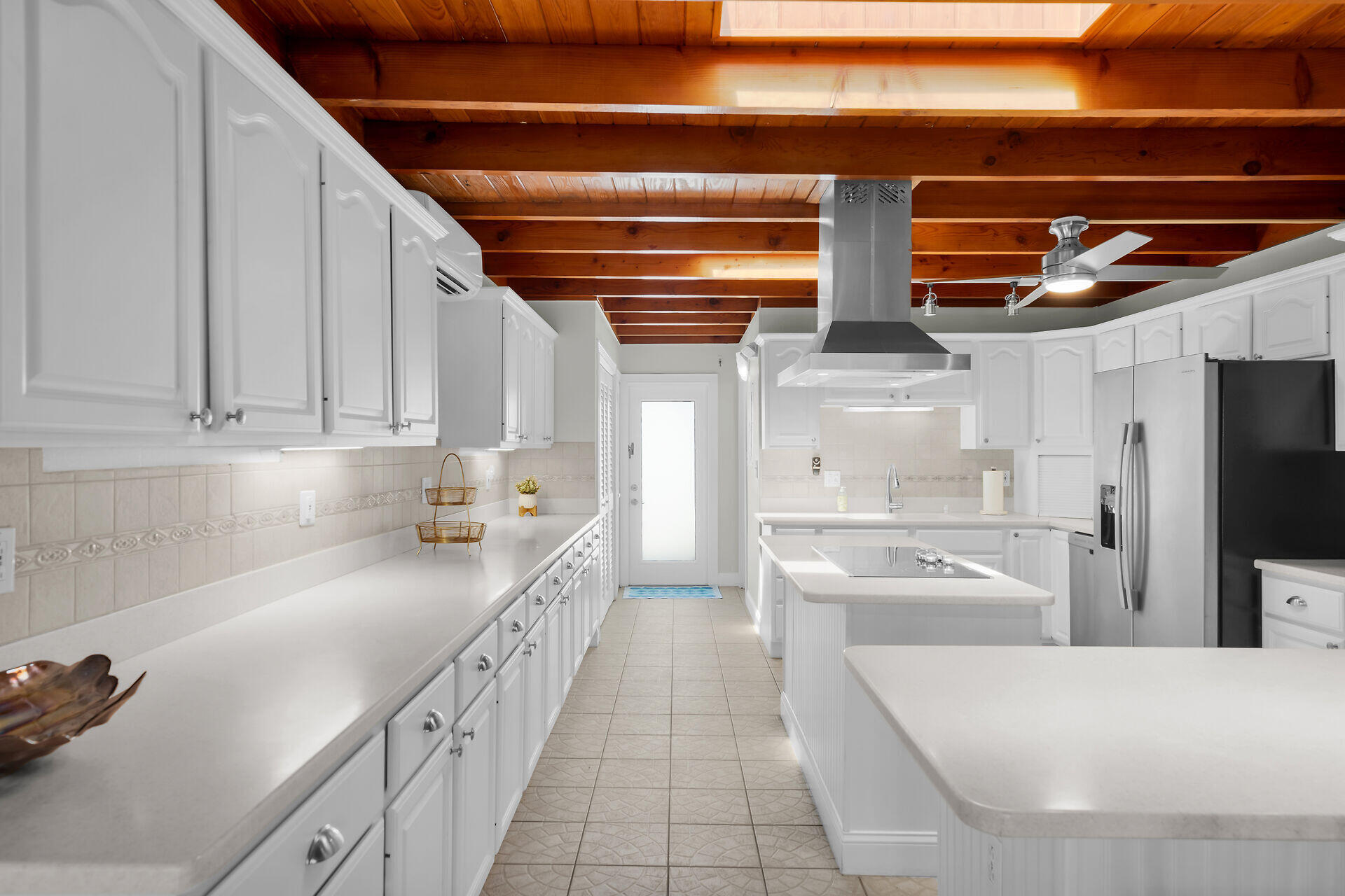 351 5th Street Key Colony Beach, FL 33051 - Photo 20 of 43 a kitchen with stainless steel appliances lots of counter space and wooden floor