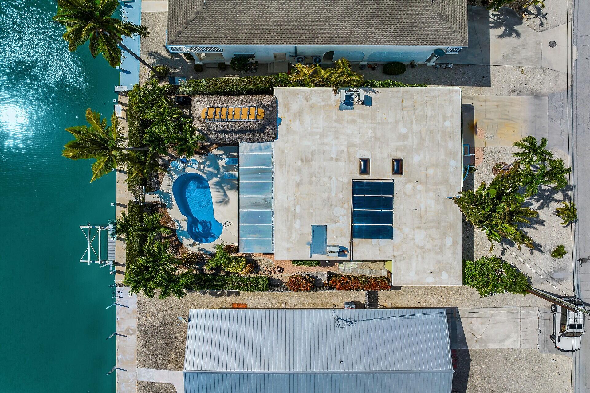 351 5th Street Key Colony Beach, FL 33051 - Photo 2 of 43 a front view of a house with plants
