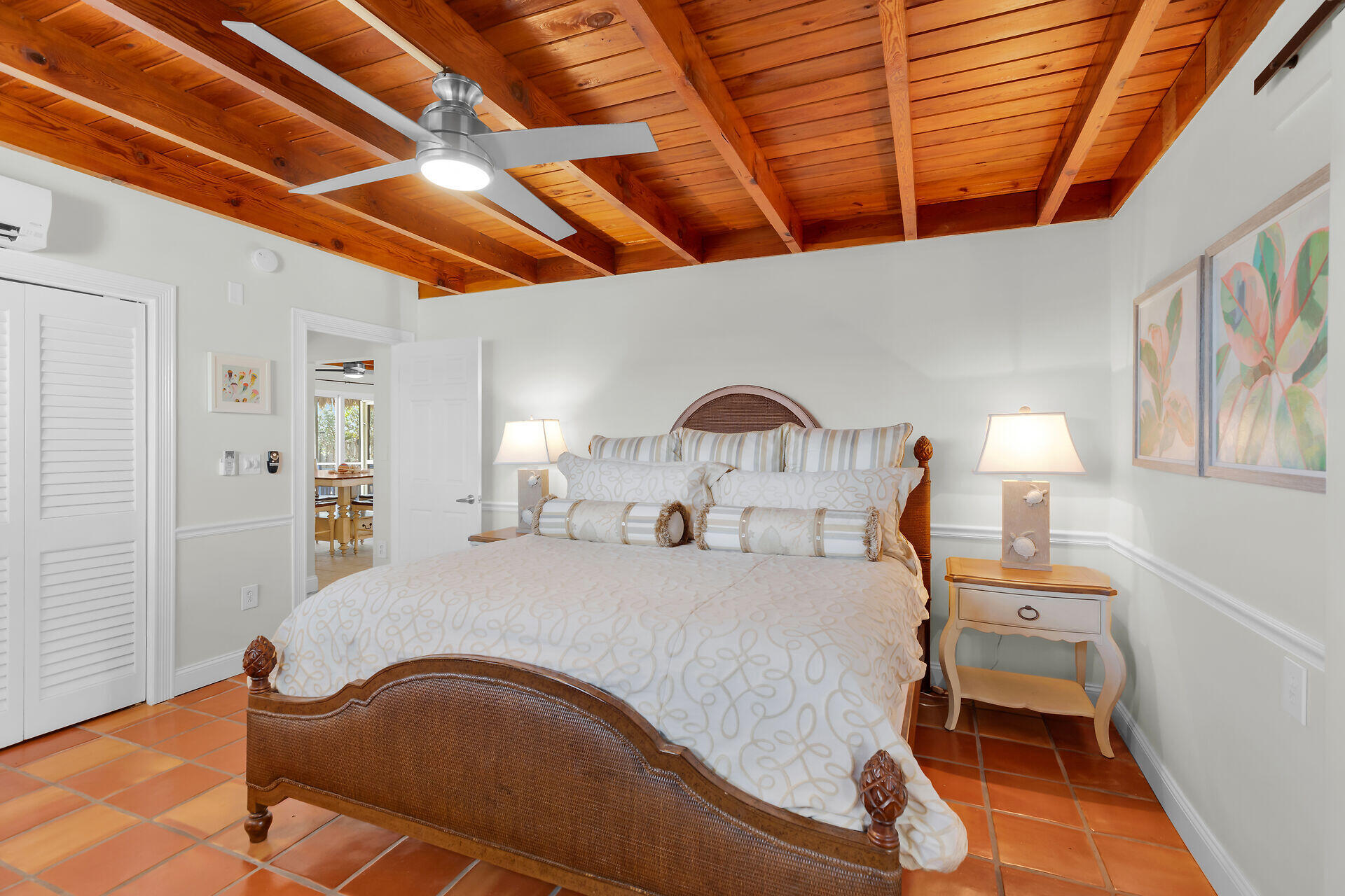 351 5th Street Key Colony Beach, FL 33051 - Photo 27 of 43 a bedroom with furniture and a wooden floor