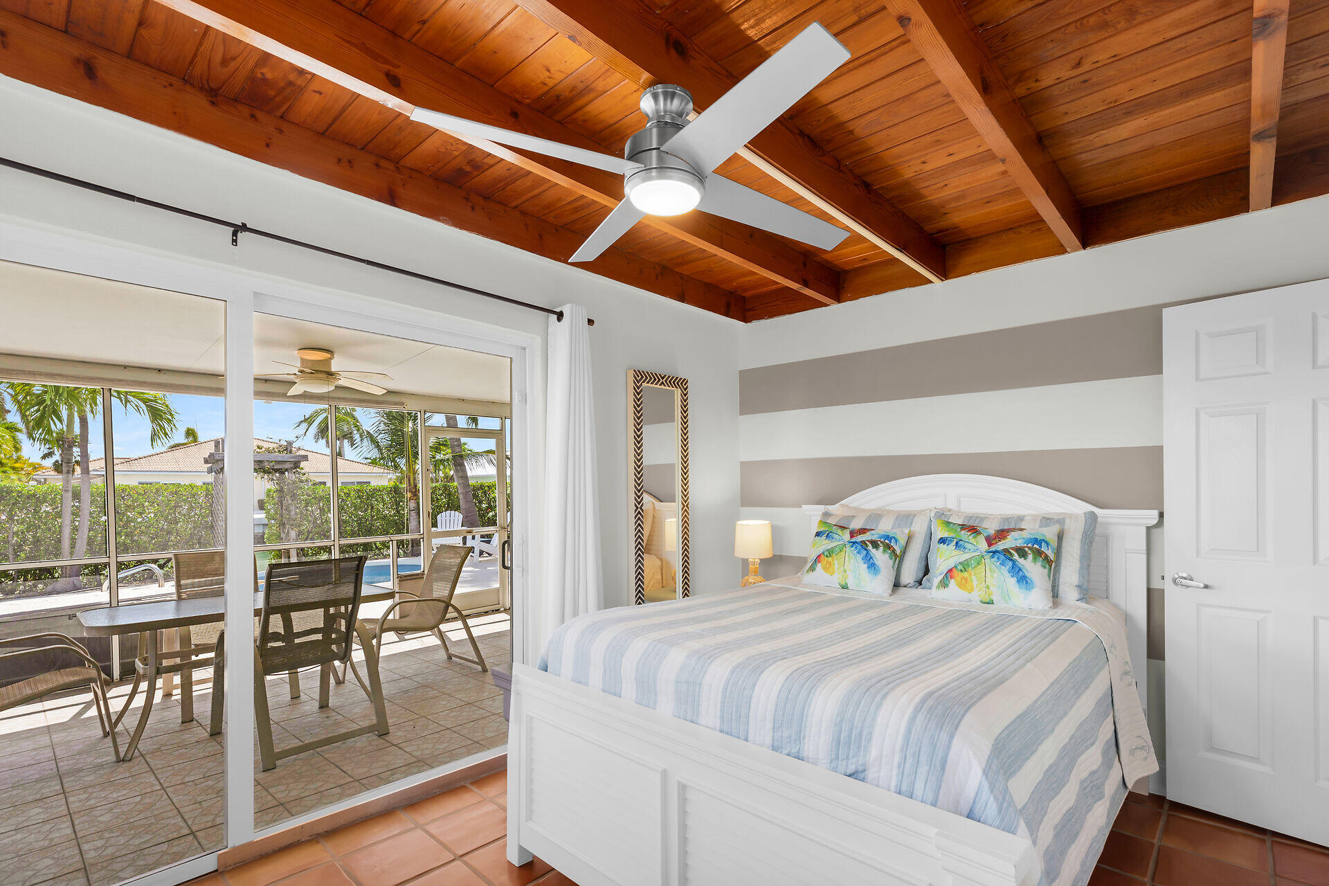 351 5th Street Key Colony Beach, FL 33051 - Photo 30 of 43 a bedroom with a bed and a large window with balcony view