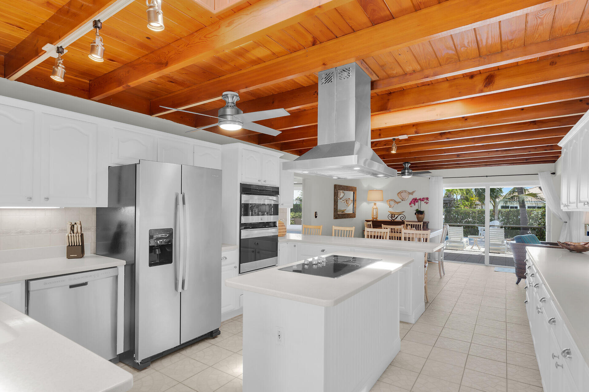 351 5th Street Key Colony Beach, FL 33051 - Photo 3 of 43 a kitchen with refrigerator and cabinets