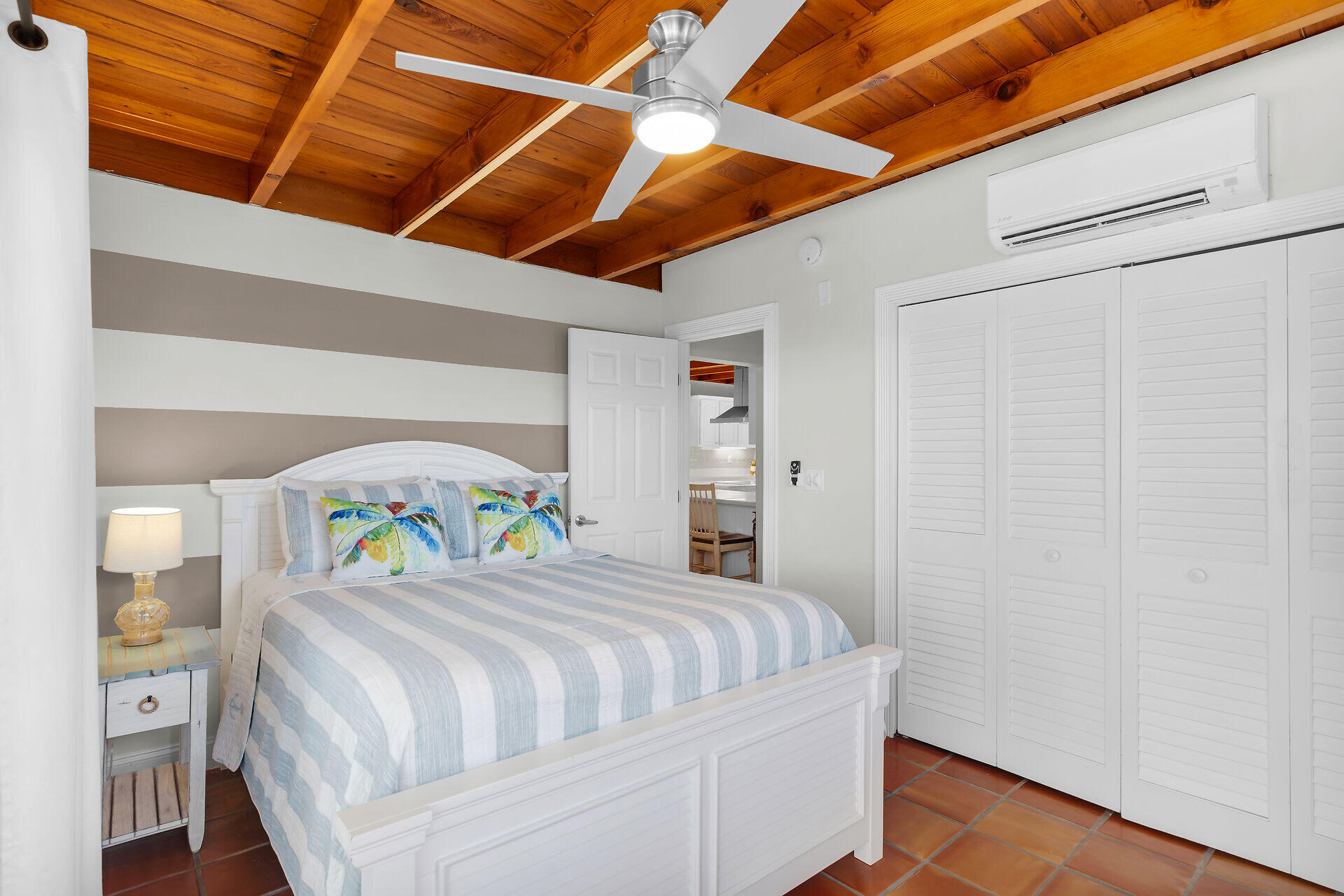 351 5th Street Key Colony Beach, FL 33051 - Photo 31 of 43 a bedroom with a bed a desk and chair