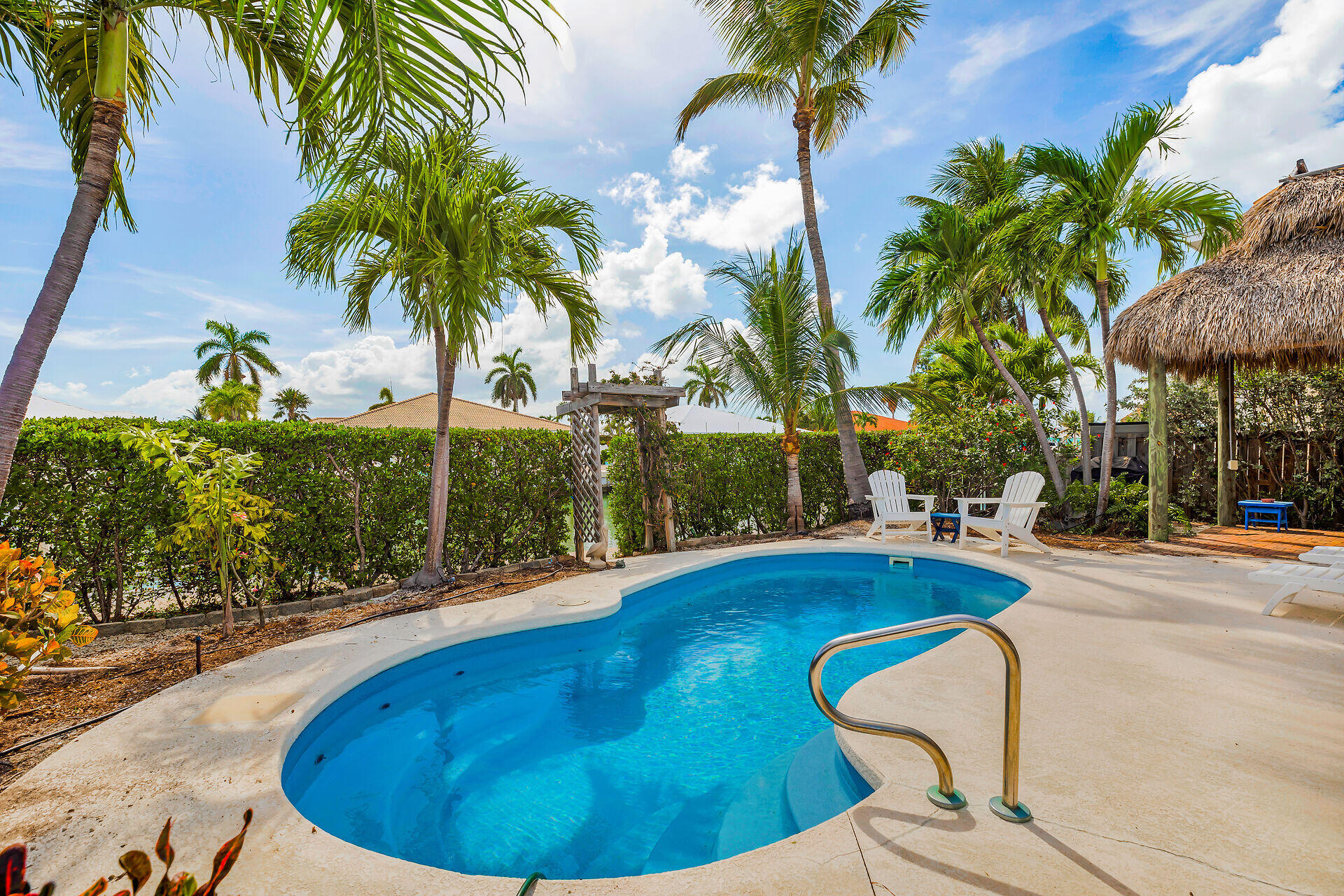 351 5th Street Key Colony Beach, FL 33051 - Photo 34 of 43 a view of a swimming pool with a patio