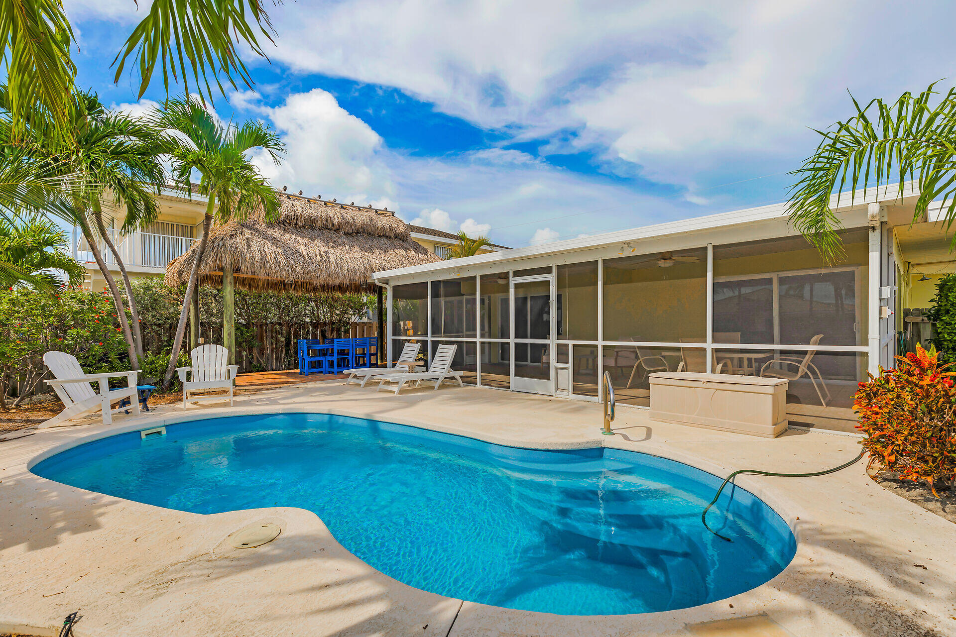 351 5th Street Key Colony Beach, FL 33051 - Photo 40 of 43 a view of a swimming pool with an outdoor seating