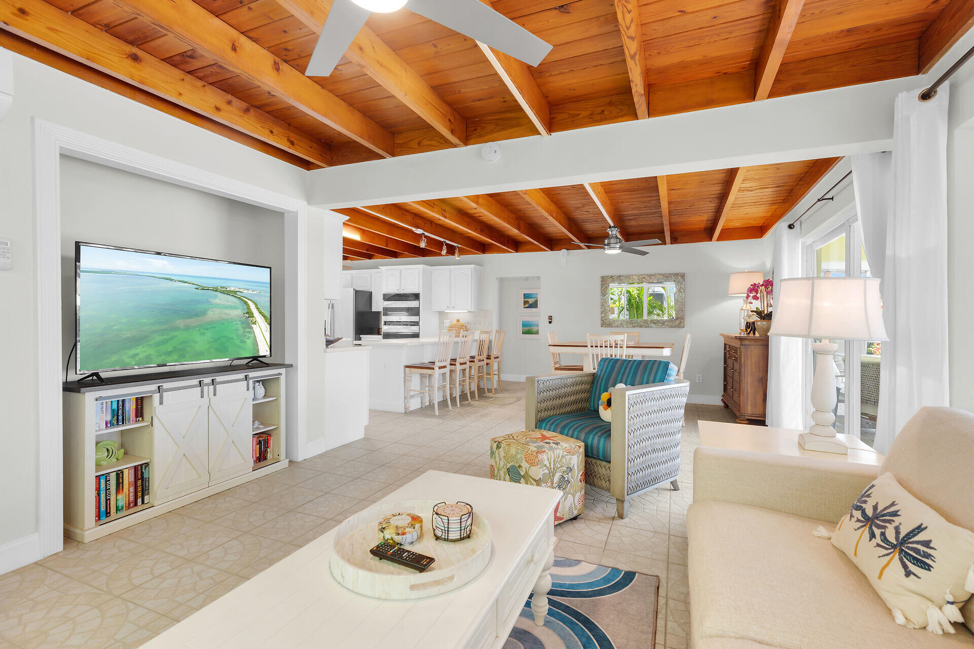 351 5th Street Key Colony Beach, FL 33051 - Photo 5 of 43 a living room with furniture and a flat screen tv