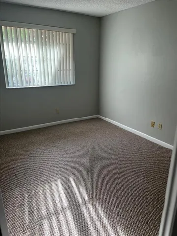 en empty room with windows