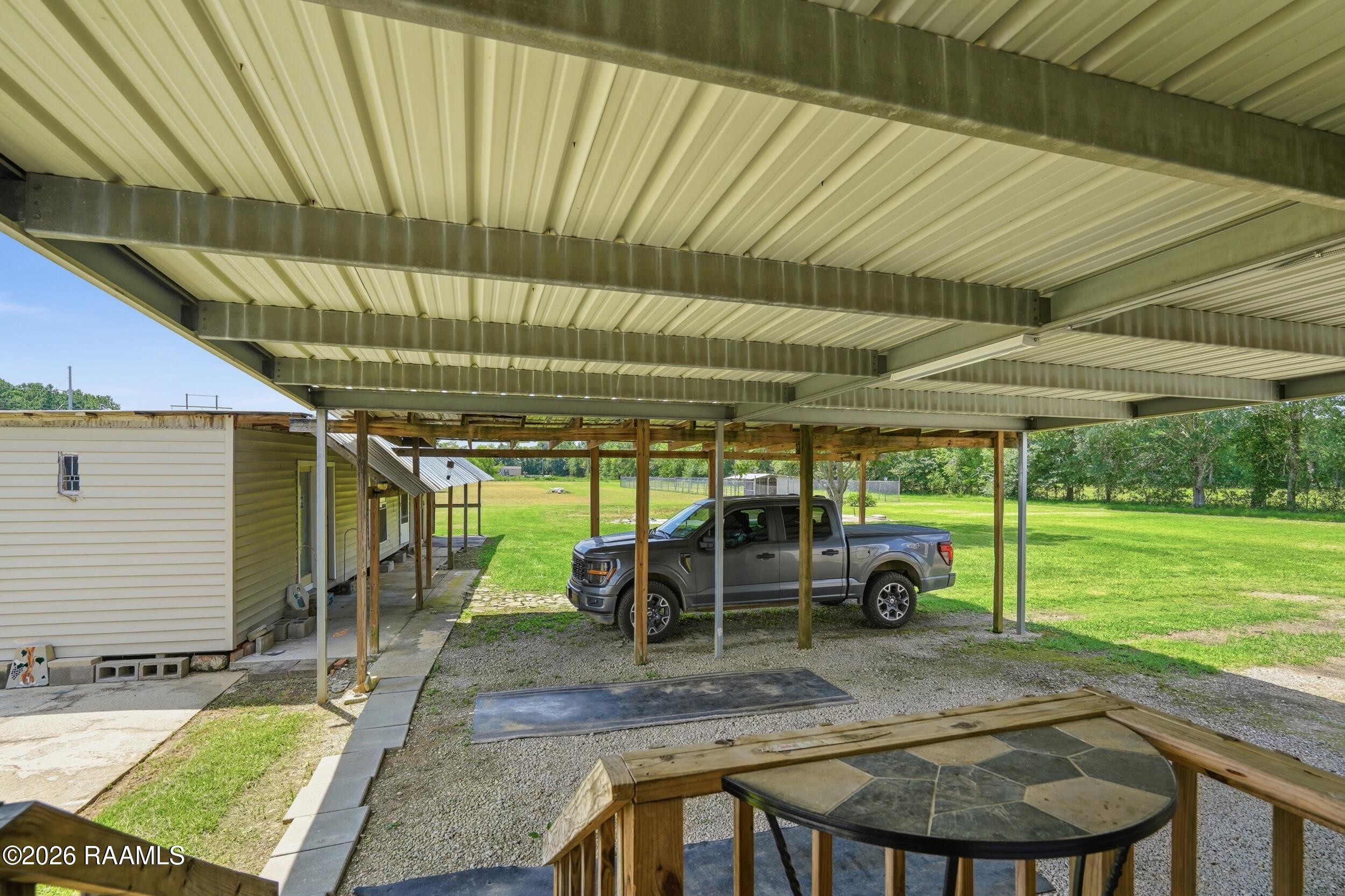 239 Canadian Church Point Church Point, LA 70525 - Photo 14 of 19 Carport Area